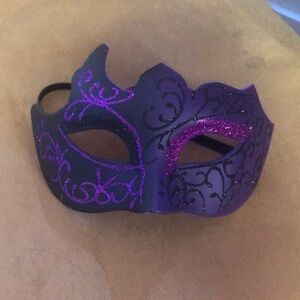 Purple with glitter masquerade mask never worn.